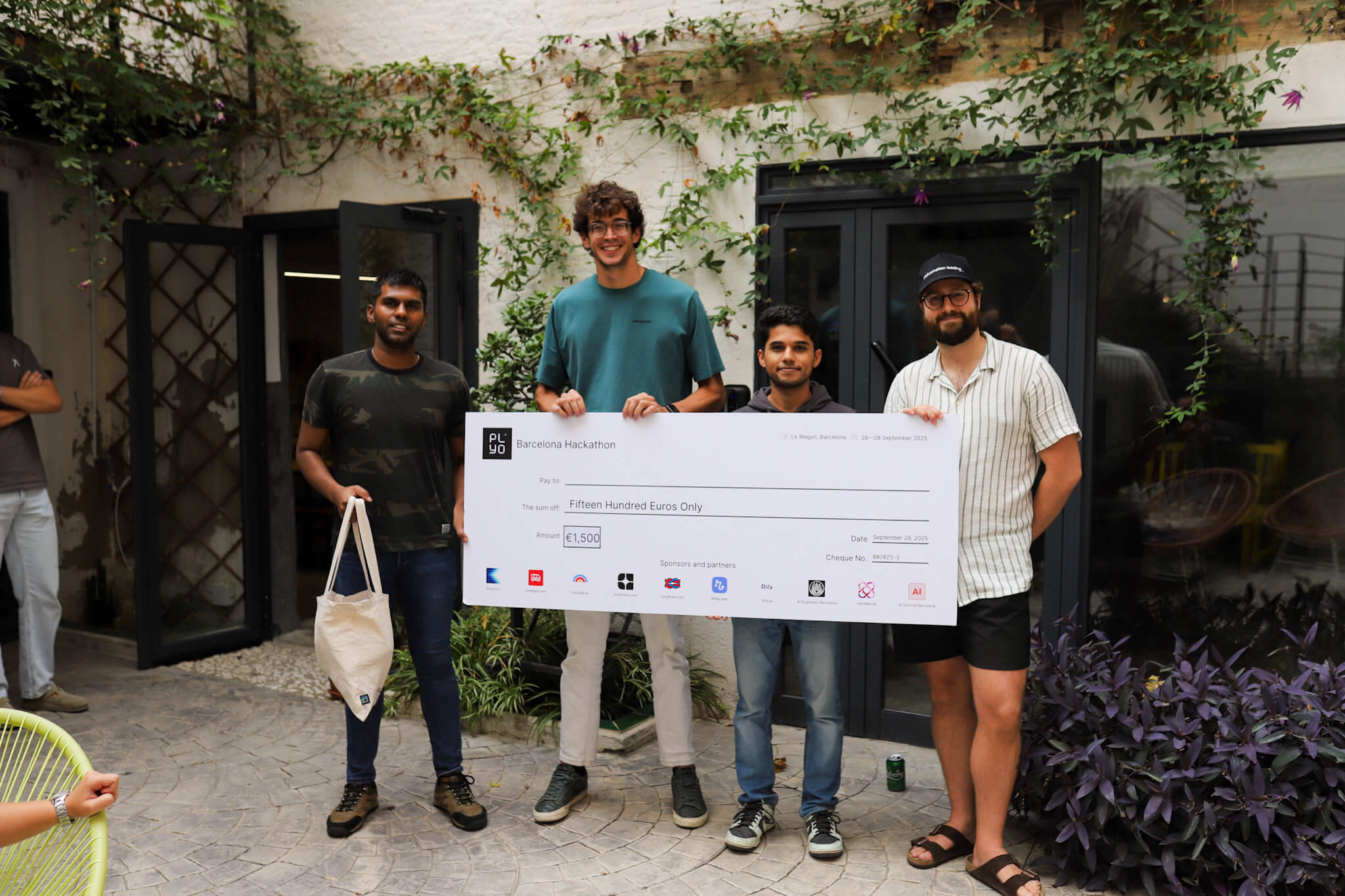 Winners holding prize check